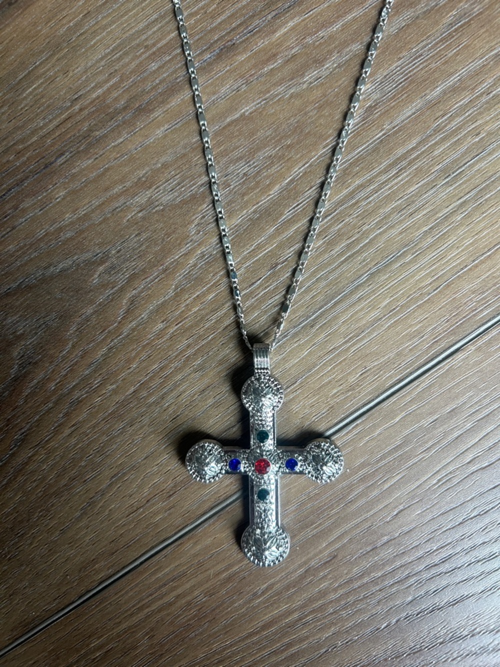 Silver Cross Pendant Necklace with Blue and Red Gem Accents